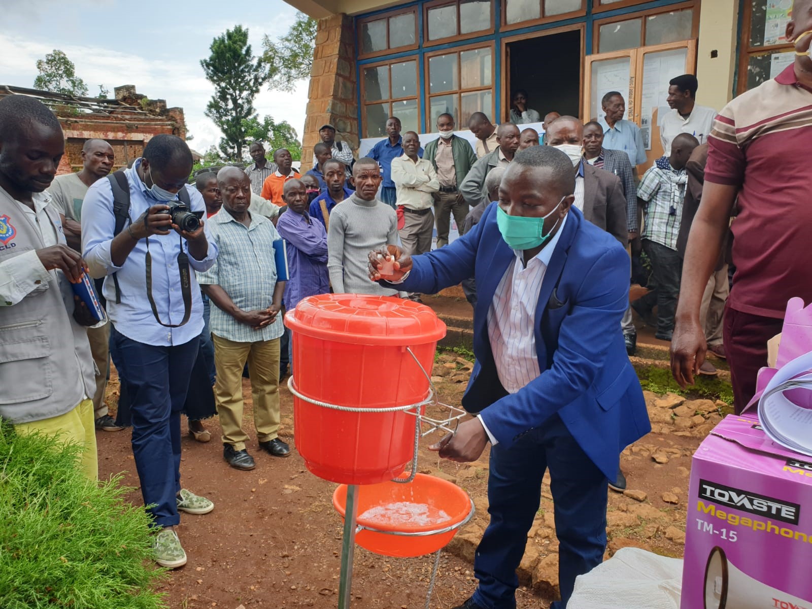 The Honorable Provincial MP, Mr. Cirimwami (right) washing his hands